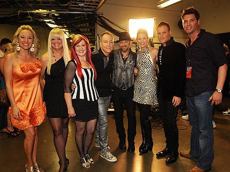 (L-R) CMT Insider host Katie Cook; Cindy Wilson, Kate Pierson, Fred Schneider of the B-52's; Kristian Bush and Jennifer Nettles of Sugarland; Keith Strickland of B-52's; and UMGN SVP of Artist Development and Marketing Jason Owen. (Photo: Rick Diamond/Getty Images)