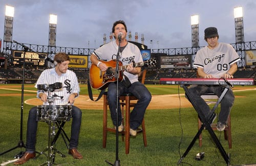 (L-R): Erich Wigdahl, Nail, and Eric Kinney perform for before the White Sox game. Photo: Ron Vesely