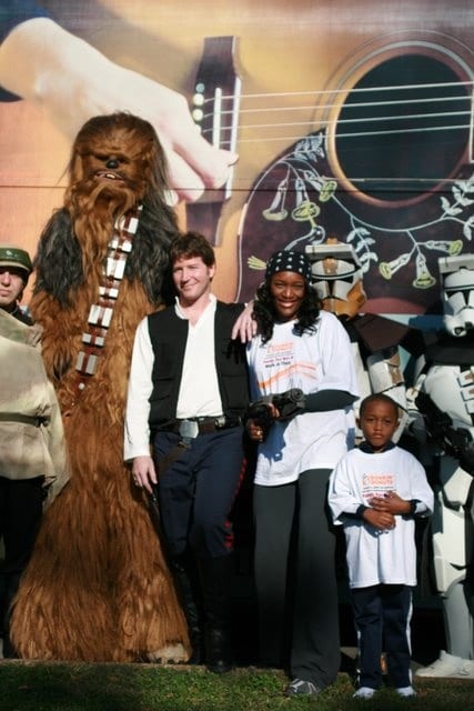 Taj and Eriq George with Star Wars Characters at the Dunkin' Donuts Family 