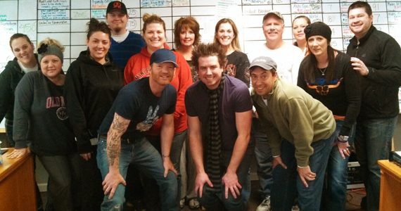 LMG artist Josh Pruno (blue hat) recently visited KTJJ’s Kirk Mooney (Front, Right) and the staff at J98. Pruno is artist with blue hat. His guitarist Micheal Blakemore is in the center. Pruno lands at No. 50 this week with “23rd Psalm.”