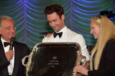 BMI President & CEO Del Bryant (left) and BMI Vice President & General Manager, Writer/Publisher Relations Barbara Cane present Adam Levine with the President's Award at the 61st Annual BMI PopAwards. Photo credit: Lester Cohen