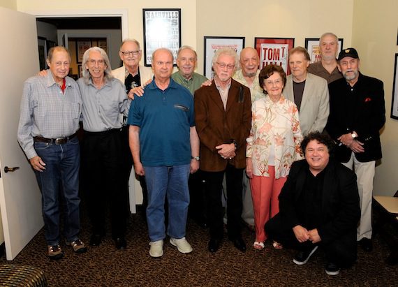 Pictured, left to right, Chip Young, Wayne Moss, Weldon Myrick, Pig Robbins, Jerry Kennedy, Bergen White, Fred Foster, Millie Kirkham, Reggie Young, David Briggs, Ray Stevens and program host Bill Lloyd (front). Photo: Donn Jones