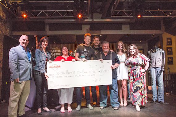 Pictured: Brian Kelley and Tyler Hubbard of Florida Georgia Line center, appear with Second Harvest Food Bank and Hard Rock Cafe Nashville representatives at the recent memorabilia donation on Tuesday, June 4, 2013 at Hard Rock Cafe Nashville. (Photo credit: Hard Rock International)