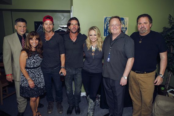 Pictured (L-R): WKLB Program Director, Mike Brophey; WKLB Music Director, Ginny Rogers; Moore; songwriter and CMA Board Member Brett James; Lambert; Sony Music Nashville Chairman and CEO and CMA Board Member, Gary Overton; and songwriter, CMA Songwriters Series host, and CMA Board member, Bob DiPiero. Photo: Natasha Moustache/CMA