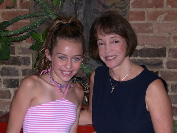 Pictured (L-R): A young Miley Cyrus with Renee Grant-Williams