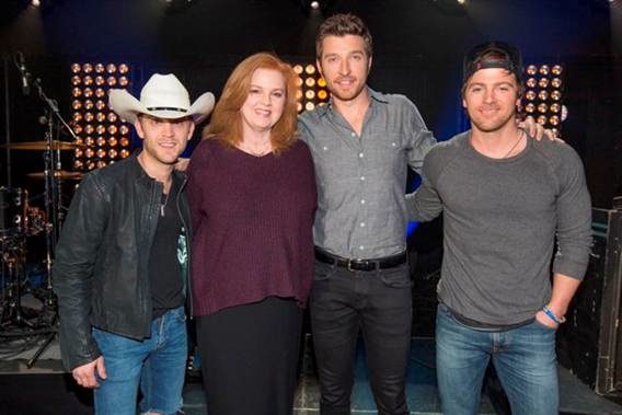 Pictured (L-R): Justin Moore; Suzanne Gordon, vice president of programming, Great American Country; Brett Eldredge, and Kip Moore. (Credit: Ed Rode)