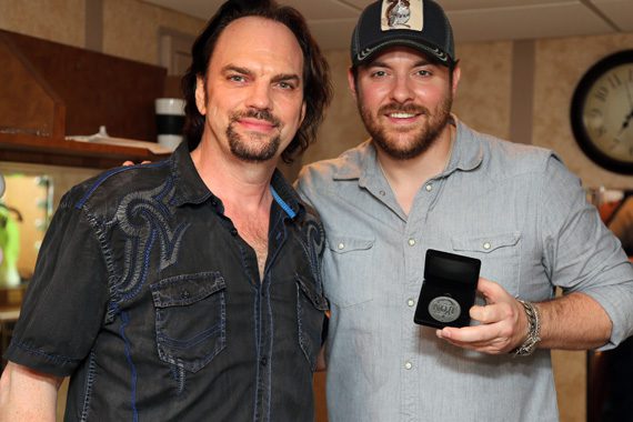 Chris Young is presented his MusicRow No. 1 Challenge Coin for "Who Am I With You" by MusicRow Publisher/Owner Sherod Robertson