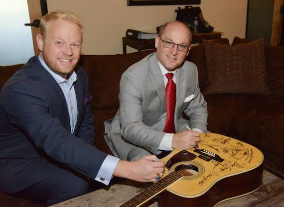 Pictured: Dailey & Vincent sign a guitar at the Academy of Country Music in Encino, Calif. Photo: Michel Bourquard/ACM