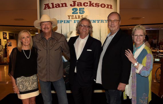 Pictured are: (L-R): Denise Jackson, Alan Jackson, the Country Music Hall of Fame and Museum's Kyle Young, Universal Music Nashville's Mike Dungan, and the Country Music Hall of Fame and Museum's Carolyn Tate at the opening of the "Alan Jackson: 25 Years of Keepin' It Country" exhibit at Country Music Hall of Fame and Museum on August 27, 2014 in Nashville, Tennessee.  (Photo by Rick Diamond/Getty Images for Country Music Hall Of Fame And Museum) 