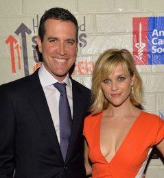 Reese Witherspoon shows off some cleavage in a sexy orange dress while attending the 2014 Hollywood Stands Up to Cancer Event on Tuesday (January 28) in Culver City,