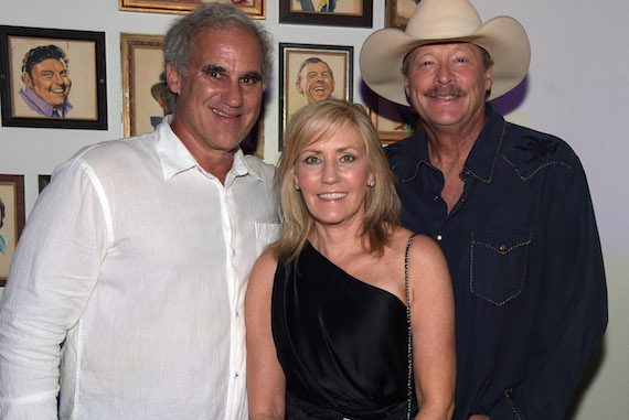 CEO/Acme Tom Morales, Denise Jackson with Singer/Songwriter Alan Jackson attend Acme Feed & Seed Grand Opening Party. Photo: Rick Diamond/Getty Images 