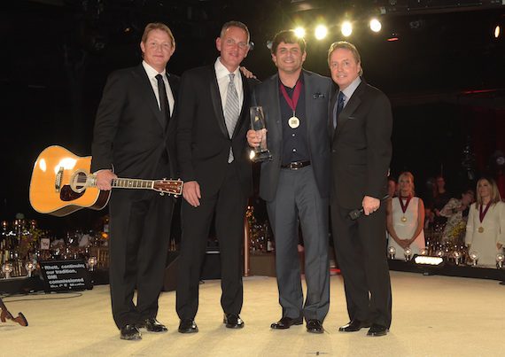 Rhett Akins (second from right) accepts the award for Songwriter of the Year with BMI Assistant Vice President, Writer/Publisher Relations, Clay Bradley, BMI President and CEO Mike O'Neill, and BMI Vice President, Writer/Publisher Relations, Jody Williams onstage at the BMI 2014 Country Awards at BMI on November 4, 2014 in Nashville, Tennessee. Photo:  Rick Diamond/Getty Images for BMI