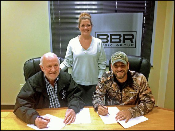Pictured (L-R): BBR Music Group Owner/CEO Benny Brown; Magic Mustang Music VP Juli Newton-Griffith; artist Craig Campbell. 