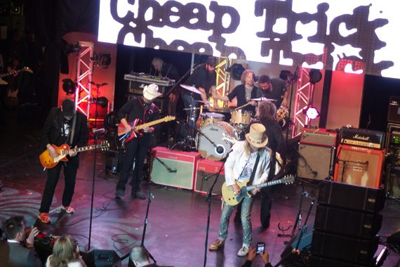 Brad Paisley performs with the night’s show-closing special surprise guest, Cheap Trick.