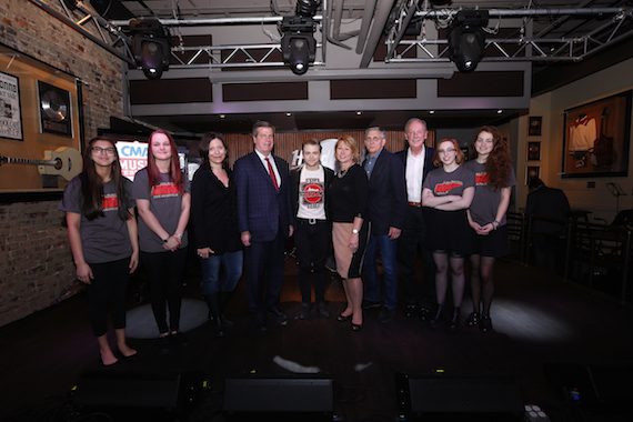 Pictured (L-R): Zoe McCadams and Emily Davis from the Nashville School of the Arts Guitar Quartet; Sally Williams, Vice President of Business and Partnership Development of Ryman Auditorium and CMA Board President-Elect; Nashville Mayor Karl Dean; Hunter Hayes; Sarah Trahern, CMA Chief Executive Officer; Butch Spyridon, President, Nashville Convention & Visitors Corp.; Frank Bumstead, Chairman of Flood, Bumstead, McCready & McCarthy and CMA Board Chairman; Sophie Allison and Rachel Hambridge from the Nashville School of the Arts Guitar Quartet. Photo: Donn Jones / CMA