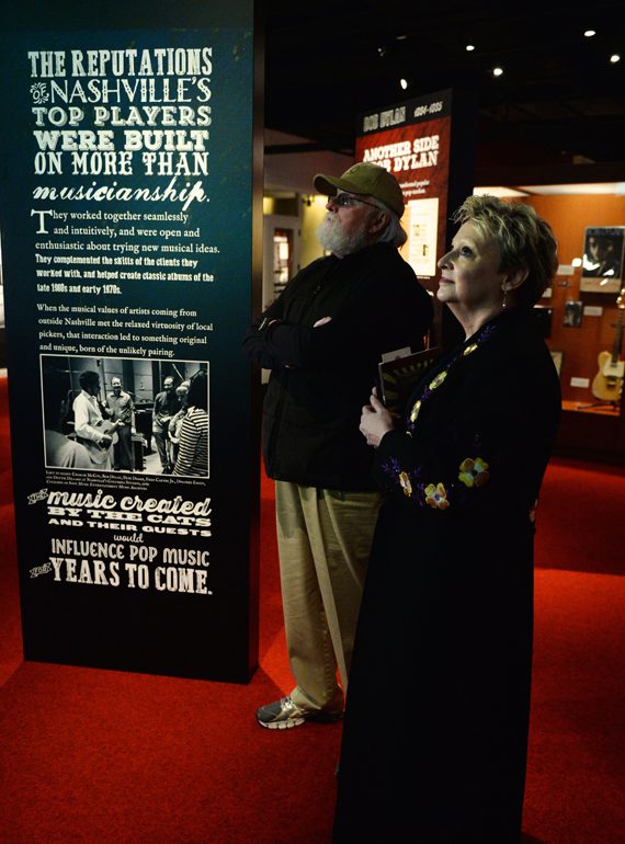 Nashville Cat Charlie Daniels (background) browses the galleries with CMHoF's Carolyn Tate (foreground). Photo: Jason Davis, Getty Images
