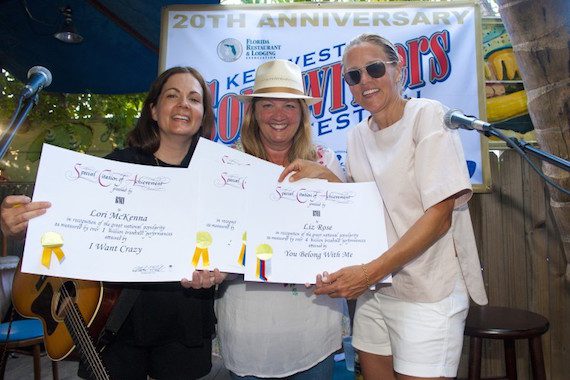 Pictured: Lori McKenna and Liz Rose receive certificates of achievement for 1 million plus broadcast performances from BMI’s Leslie Roberts at Blue Heaven during the Key West Songwriter’s Festival on May 7, 2015, in Key West, FL. Photo: Erika Goldring. 
