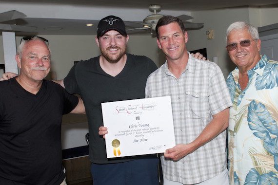 Pictured: KWSWF’s Charlie Bauer, Chris Young, BMI’s Mark Mason and Mayor Craig Cates gather for a photo after presenting Young with a certificate of achievement during Key West Songwriter’s Festival on May 9, 2015, in Key West, Fla. Photo: Erika Goldring.