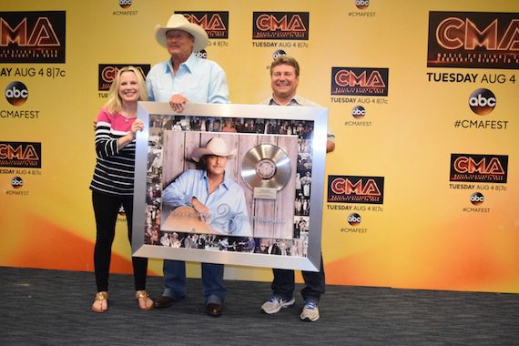 UMGN's Cindy Mabe and Tom Becci honor Alan Jackson's 25 years in music backstage at LP Field.