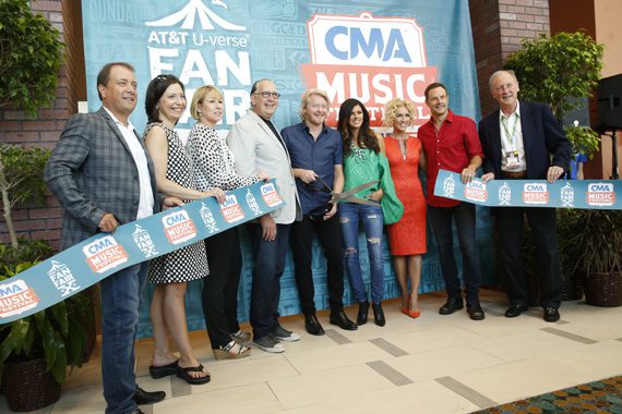 Thursday's Artist of the Day Little Big Town cut the ribbon to AT&T U-verse® Fan Fair X at the Music City Center, kicking off the 2015 CMA Music Festival. (L-R): Brian Collins, Vice President of Wireline Consumer Marketing, AT&T Home Solutions; Sally Williams, Vice President, Business and Partnership Development of Ryman Auditorium and CMA Board President Elect; Sarah Trahern, CMA Chief Executive Officer; John Esposito, CEO Warner Music Nashville and CMA Board President; Little Big Town's Phillip Sweet, Karen Fairchild, Kimberly Schlapman, and Jimi Westbrook; and Frank Bumstead, Chairman Flood, Bumstead, McCready & McCarthy and CMA Board Chairman. Photo: John Russell/CMA