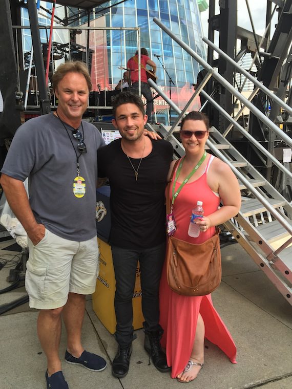 Atlantic Records artist Michael Ray brought his Top 15 and climbing debut single, “Kiss You In The Morning,” to sunbathed crowd at the CMA Music Festival. Following his performance yesterday on the Bud Light Stage at Bridgestone Arena, Ray visited with fans, friends and family. Photo from left to right – Scott Hendricks, Ray’s producer and EVP A&R Warner Music Nashville; Ray and Rebekah Gordon, Director A&R, WMN