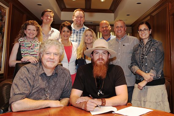 Daniel Hill, President, Spirit Music Nashville is announcing the signing of Tim Montana to a publishing deal. Attached is the signing photo. "Pictured (front row, l-r) are Daniel Hill (President), Tim Montana, (back row, l-r) Carrie Gallo (Creative Dir.), Ross Cameron (Sr. Dir. Acquisitions), Denise Stevens (Loeb & Loeb), Brian Bradford (Dir. Admin.), Paula Kay Hornick (Manager), Jon Singer (CFO), Billy Lynn (VP Creative), and Michelle Davey (Admin. Asst./Office Mgr.).