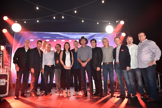 Tim McGraw (center) celebrates "Shotgun Rider" with songwriters and industry members.