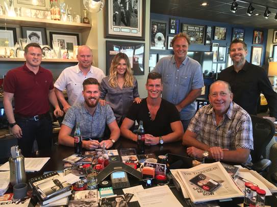 Pictured (L-R): Jason Turner, Keller Turner Ruth Andrews & Ghanem PLLC; Nick Meinema, United Talent Agency; Cris Lacy, VP A&R, Warner Music Nashville; Scott Hendricks, EVP A&R, WMN; Bryan Coleman, Union Entertainment Group, INC Front Row, left to right: Curtis Rempel &  Brad Rempel of High Valley & WMN President & CEO John Esposito