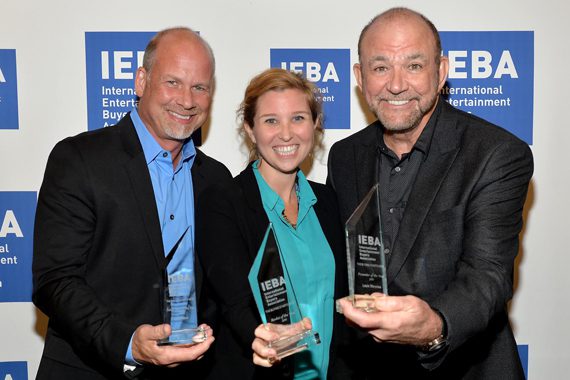 Pictured (L-R): WME's Kevin Neal, CAA's Kylen Sharpe, and Louis Messina of Messina Touring Group pose backstage with their awards during the Honors and Awards Ceremony at the IEBA 2015 Conference. Photo: Jason Davis/Getty Images