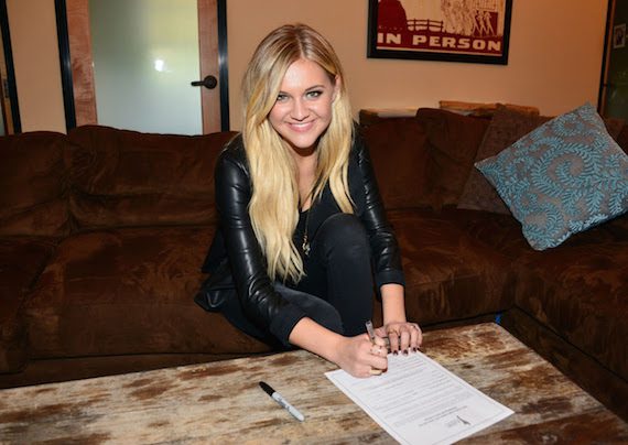 Kelsea Ballerini signing up for Academy of Country Music membership.  Photo: Michel Bourquard/Courtesy of the Academy of Country Music 