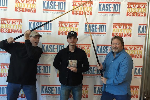 Granger Smith (center) goofs around with  at his hometown station in Austin -IHEART's KASE promoting his new release REMINGTON out on 3/4. VP of programming Travis Moon & MD Bob Pickett
