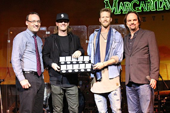 Pictured: FGL's Tyler Hubbard and Brian Kelley accept MusicRow No. 1 Challenge Coins to celebrate their chart-topping hits.
