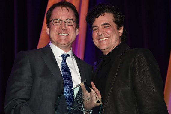Big Machine Label Group's Scott Borchetta (right) presents Brian Phillips with the Frances Preston Outstanding Music Industry Achievement Award at the T.J. Martell Foundation 8th Annual Nashville Honors Gala at the Omni Nashville Hotel on February 29, 2016 in Nashville, Tennessee. (Photo: Rick Diamond/Getty Images for T.J. Martell)