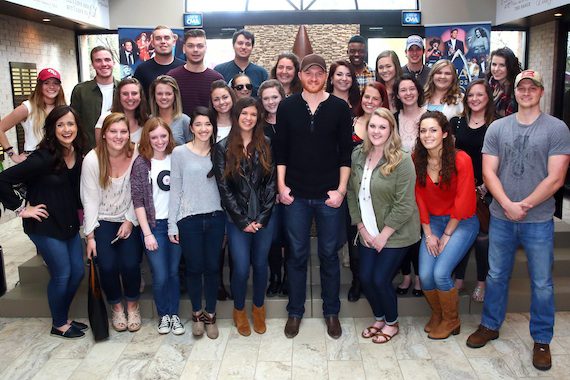 Eric Paslay (center) gathers with CMA EDU students from Belmont, Middle Tennessee State, and Vanderbilt Universities Thursday at the CMA office. Photo: Kayla Schoen / CMA