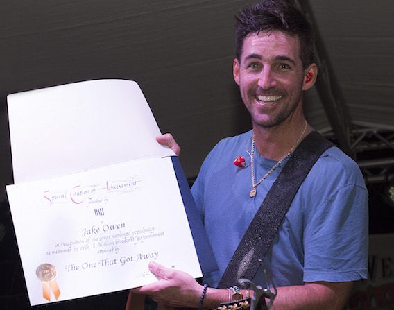 Jake Owen receives a Millionaire Award during his concert on the Duval Street stage during Key West Songwriters Festival on May 7, 2016. Photo: Erika Goldring