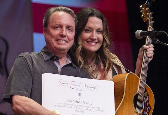 BMI's Jody Williams presents Natalie Hemby with a Millionaire Award at the San Carlos Institute during Key West Songwriters Festival on May 5, 2016. (Erika Goldring Photo)