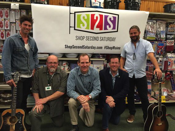 Pictured (Standing, L-R): BMI Songwriters Dave Pahanish, Hugh Mitchell Kneeling: Reny's Store Manager Carl Hodge, BMI's Dan Spears, Retail Association of Maine Executive Director Curtis Picard.