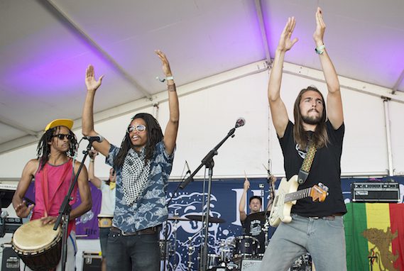 Pictured: Roots of a Rebellion get the crowd going during their set at Bonnaroo. The group won the BMI Road to Roo competition in the spring. Photo: Erika Goldring. 