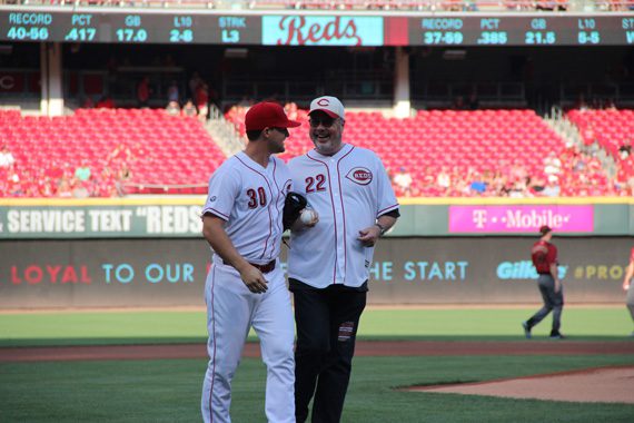 Mike Dungan, who serves as Chairman/CEO of Universal Music Group Nashville, throws the ceremonial first pitch to Reds outfielder Kyle Waldrop at the Cincinnati Reds game on Saturday, July 23, 2016.