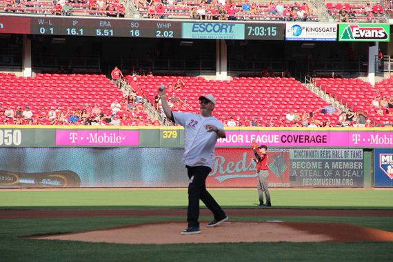 Mike Dungan, who serves as Chairman/CEO of Universal Music Group Nashville, throws the ceremonial first pitch to Reds outfielder Kyle Waldrop at the Cincinnati Reds game on Saturday, July 23, 2016.