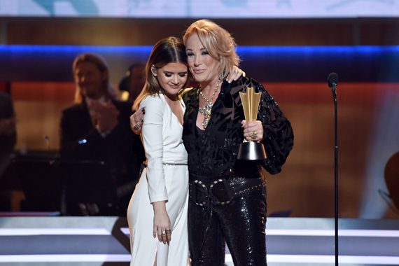 NASHVILLE, TN - AUGUST 30: Musicial artists Maren Morris presents an award to Tanya Tucker onstage at the Ryman Auditorium on August 30, 2016 in Nashville, Tennessee. (Photo by John Shearer/Getty Images for ACM)