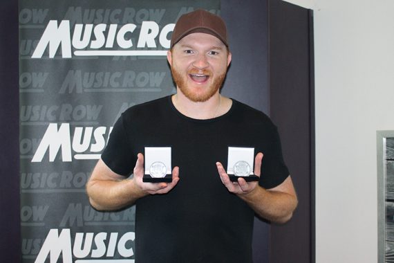 Eric Paslay accepts his MusicRow Challenge Coins for "Song About A Girl" and "Rewind." Photo: Molly Hannula 