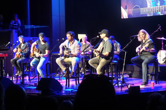 Luke Bryan performs with songwriters Ashley Gorley, Dallas Davidson and Chris DeStefano.