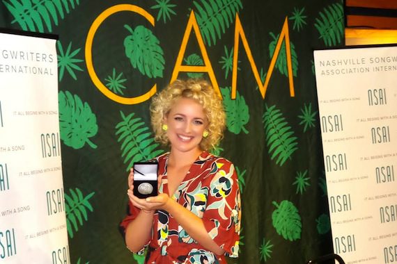 Cam accepts her No. 1 MusicRow Challenge Coin for "Burning House."