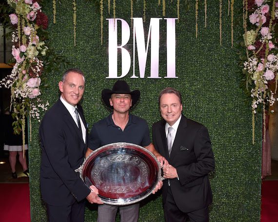 BMI President & CEO MikeO'Neill and BMI Vice President, Writer/Publisher Relations Jody Williams posewith 2016 President's Award recipient Kenny Chesney. Pictured L to R: O'Neill,Chesney, Williams.