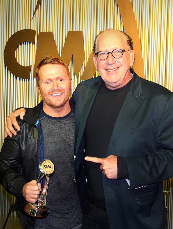 CMA Board Chairman John Esposito (right) presents "Forever Country" musical producer and CMA Board member Shane McAnally with the CMA Chairman's Award Monday night during a CMA Board dinner at the Association's new Music Row headquarters. Photo: Christian Bottorff / CMA