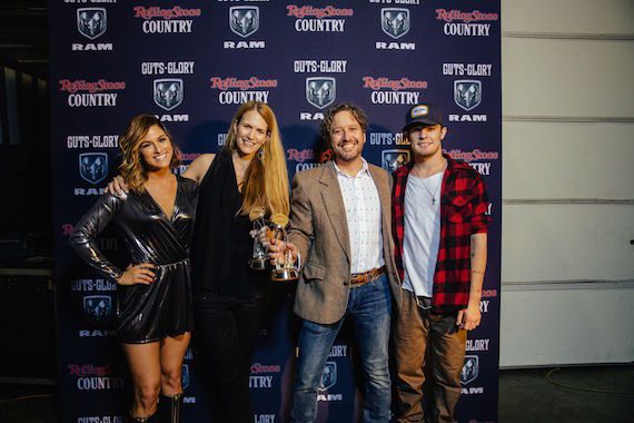 Rolling Stone Country's Beville Dunkerley and Joseph Hudak (center) receive the 2016 CMA Media Achievement Award from Country artists Cassadee Pope (l) and Tucker Beathard. Photo: Joseph Llanes